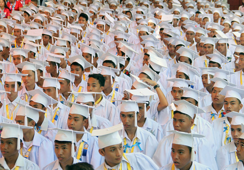 Students sing the graduation song during commencement exercises at Justice Cecilia Munoz Palma High School in Quezon City on Wednesday. Photo By Mike De Juan 