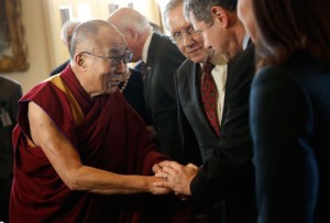 The Dalai Lama (left) greets Sen. Sherrod Brown (D-OH) as Senate Majority Leader Harry Reid (D-NV) looks on at the Capitol on Thursday (Friday in Manila) in Washington, D.C.. AFP PHOTO 