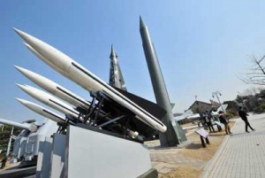 Visitors walk past replicas of a North Korean Scud-B missile (right) and South Korean Hawk surface-to-air missiles at the Korean War Memorial in Seoul on Monday. AFP PHOTO