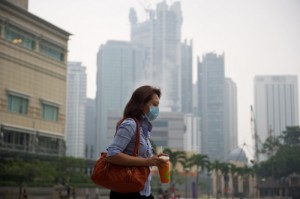 A photo taken on February 20 shows people walking along the promenade at Marina Bay in Singapore. AFP PHOTO