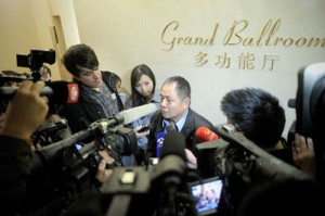 A relative (center) of passengers from missing Malaysia Airlines flight MH370 speaks to the media at a hotel in Beijing on Tuesday. Intelligence checks on the 153 Chinese passengers aboard a missing Malaysian airliner produced no red flags, China said, as investigators struggled to clarify events that led to the plane’s dramatic disappearance. AFP PHOTO