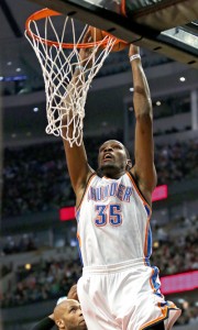  Kevin Durant No.35 of the Oklahoma City Thunder dunks over Taj Gibson No.22 of the Chicago Bulls at the United Center on March 17, 2014 in Chicago, Illinois. AFP PHOTO