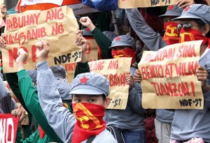 NDF supporters hold a lightning rally at Philcoa in Quezon City on Saturday, the 45th anniversary of the Philippine communist movement. Photo by Mike de Juan