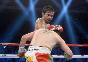 Manny Pacquiao pummels Brandon Rios in their December 2013 fight. AFP FILE PHOTO