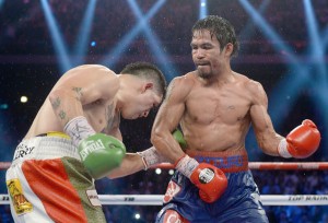 Manny Pacquiao (right) and Brandon Rios slug it out during their November 24, 2013 fight. AFP FILE PHOTO