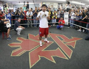 Manny Pacquiao mingles with boxing fans and members of the press at the Wild Card Gym. AFP FILE PHOTO