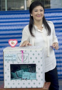 Thai Prime Minister Yingluck Shinawatra casts her ballot in the Senate elections at a polling station in Bangkok on Sunday. AFP PHOTO