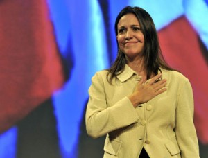 Venezuelan opposition deputy Maria Corina Machado touches her chest as she listens to an applause in her support during a seminar on democracy in Latin America on Monday. The President of Venezuela’s national Assembly, Diosdado Cabello, said that Machado lost her status of deputy after she attempted to speak during the Organization of American States meeting on Friday. AFP PHOTO