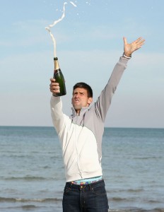 Novak Djokovic of Serbia celebrates by spraying champagne on Crandon Park beach after his straight sets victory against Rafael Nadal of Spain during their final match during day 14 at the Sony Open at Crandon Park Tennis Center on March 30, 2014 in Key Biscayne, Florida. AFP PHOTO