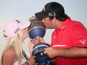 Patrick Reed celebrates with his wife Justine on the 18th green after his one-stroke victory during the final round of the World Golf Championships-Cadillac Championship at Trump National Doral in Doral, Florida. AFP PHOTO