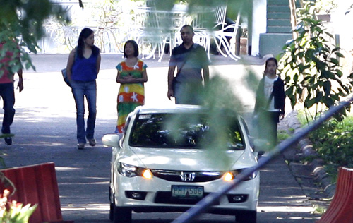 Former president Gloria Macapagal Arroyo (second from left) bids farewell to an unknown guest who visited her at the Veterans Memorial Medical Center on Friday, a day before her 67th birthday. The Sandiganbayan has allowed Arroyo three days within which to spend her birthday with her immediate family and selected guests. Photo By Miguel De Guzma 