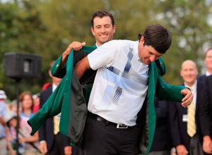 Adam Scott of Australia presents Bubba Watson of the United States with the green jacket after Watson won the 2014 Masters Tournament by a three-stroke margin at Augusta National Golf Club in Augusta, Georgia. AFP PHOTO