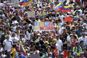 Anti-government activists hold a protest against President Nicolas Maduro in Caracas on Sunday. AFP PHOTO