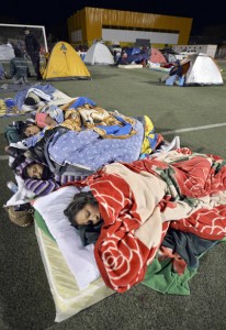 People from the town of Pozo al Monte, close to the city of Iquique, some 1,950 kilometers north of Santiago, camp out on a stadium field on Thursday, as earthquakes rocked the area over the last 48 hours. AFP PHOTO