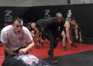 Jones (right) performs a conditioning routine.  AFP PHOTO