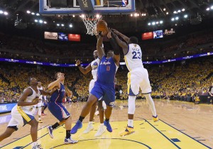 Glen Davis No.0 of the Los Angeles Clippers has his shot blocked by Draymond Green No.23 and Jarmaine O’Neal No.7 of the Golden State Warriors in Game Four of the Western Conference Quarterfinals during the 2014 NBA Playoffs at ORACLE Arena. AFP PHOTO