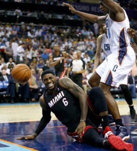 LeBron James No.6 of the Miami Heat is injured against the Charlotte Bobcats in Game Four of the Eastern Conference Quarterfinals during the 2014 NBA Playoffs at Time Warner Cable Arena in Charlotte, North Carolina. AFP PHOTO