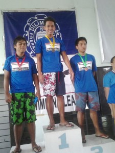 Gold medalist Jason Ryan Difuntorum (center), silver winner Emanuel Joshua Lorbes (left) and third placer Jux Solita during the awarding of the 50m butterfly event in the 57th Leg Series dubbed at PSL-Magnolia Swimfest. CONTRIBUTED PHOTO