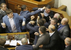 Members of Parliament of the Svoboda party fight with Members of Parliament of the Communist party in the Ukrainian parliament on Tuesday, during the debates focused on a law toughening responsibility for separatism. Ukraine’s acting president said also on Tuesday he would treat Russian separatists who have seized buildings in the east of the country as “terrorists” who will be prosecuted with the full force of the law. AFP PHOTO