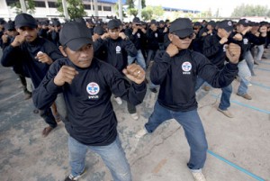 Pro-government Thai Red Shirt supporters practice self-defense in the camp of “Democracy Protection Volunteers” in Udon Thani province, northeastern Thailand on Friday. AFP PHOTO