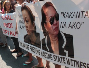 Protesters gather in front of the Department of Justice building in Manila to urge Justice Secretary Leila de Lima to reject Janet Napoles’ request to be accepted into the Witness Protection Program. PHOTO BY RUY MARTINEZ