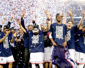 The Connecticut Huskies celebrate after defeating the Kentucky Wildcats 60-54 in the NCAA Men’s Final Four Championship at AT&T Stadium in Arlington, Texas. AFP PHOTO