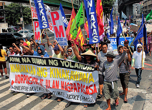 Victims of typhoon Yolanda hold a rally at Mendiola in Manila on Thursday to call the attention of the government to their plight. The rallyists, who came from Iloilo, said they have been neglected. Photo By Ruy Martinez 