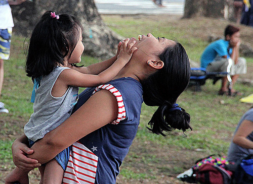 A mother plays with her child at the sunken garden in UP Diliman on the eve of Mother’s Day. Photo by MiKe de Juan 