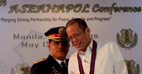 President Benigno Aquino 3rd  chats with Philippine National Police chief Alan Purisima during the Association of Southeast Asian police Chiefs of Police conference in Pasay City. The Philippines is a founding member of the group.  MALACAÑANG PHOTO 