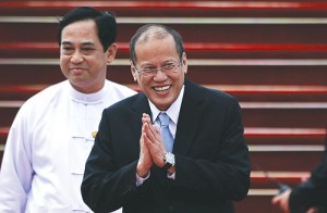President Benigno Aquino 3rd smiles as he walks on the tarmac upon arriving at the international airport in Myanmar’s capital Naypyidaw to attend the Association of Southeast Asian Nations Summit on May 10.  AFP photo  