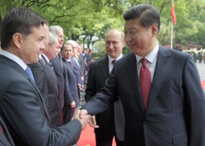 Russia’s President Vladimir Putin (center) looks at China’s President Xi Jinping shaking hands with Russian officials during a welcoming ceremony at the Xijiao State Guest house in Shanghai on Tuesday, ahead of the fourth Conference on Interaction and Confidence Building Measures in Asia summit. AFP PHOTO