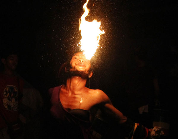 A fire performer enthralls and entertains the crowd who gathered during the town fiesta in Bambang, Pasig City. PHOTO BY MIKE DE JUAN