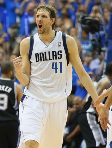 Dirk Nowitzki No.41 of the Dallas Mavericks celebrates during play against the San Antonio Spurs in Game Six of the Western Conference Quarterfinals during the 2014 NBA Playoffs at American Airlines Center. AFP PHOTO