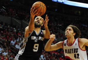 Portland, Oregon: Tony Parker No.9 of the San Antonio Spurs drives to the basket on Robin Lopez No.42 of the Portland Trail Blazers in the second half of Game Three of the Western Conference Semifinals during the 2014 NBA Playoffs at the Moda Center in Portland, Oregon. AFP PHOTO