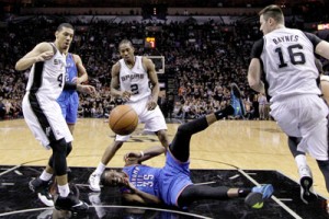 San Antonio, Texas: Kevin Durant no.35 of the Oklahoma City Thunder on the floor as the ball flies over his head against Danny Green No.4 and Kawhi Leonard No.2 of the San Antonio Spurs in the second half in Game One of the Western Conference finals during the 2014 NBA Playoffs at AT&T Center in San Antonio, Texas. AFP PHOTO