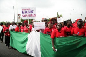 Members of civil society groups and organizations carry placards as the take part in a protest against the abduction of the Chibok schoolgirls, after they were prevented from reaching the president’s residence in Abuja on Friday. Protesters took their call for the release of more than 200 schoolgirls kidnapped by Boko Haram to Nigeria president Goodluck Jonathan, as US military personnel headed to Chad as part of the rescue effort. AFP PHOTO