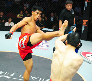 Honorio “The Rock” Banario (left) delivers a high kick against an opponent. PHOTO COURTESY OF ONE FC