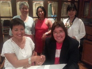 Philippine Swimming League (PSL) President Susan Papa shakes hand with Philippine Red Cross Boracay-Malay Chapter Chairman Nieva Mendoza after the agreement to hold the Ultimate Boracay 24-hour Swimming Relay to be held in Boracay in April 2015. Also in the picture are PSL Secretary Generay Maria Susan Benasa, and Red Cross officials Elena Brugger and Delnora Nano.