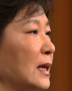 South Korea President Park Geun-Hye is in tears as makes a televised address to the nation from the presidential Blue House in Seoul on Monday over the Sewol tragedy. AFP PHOTO