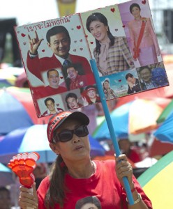 Thai progovernment “Red Shirts” protesters attend a rally to support the government in Bangkok on Sunday. Thousands of pro-government “Red Shirts” massed in Thailand’s capital to challenge attempts by opposition protesters to hand power to an unelected regime, warning that the kingdom was lurching towards “civil war.” AFP PHOTO