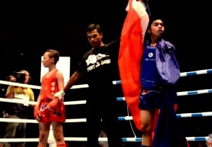 Young Filipino kickboxer Alvin Joseph Clark (far right) after winning a match. PHOTO COURTESY OF IFMA