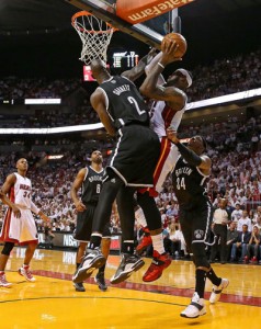 LeBron James No. 6 of the Miami Heat is fouled by Kevin Garnett No.2 of the Brooklyn Nets during Game Five of the Eastern Conference Semifinals of the 2014 NBA Playoffs at American Airlines Arena in Miami, Florida. AFP PHOTO