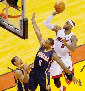 LeBron James #6 of the Miami Heat goes to the basket as Rasual Butler #8 of the Indiana Pacers defends during Game Four of the Eastern Conference Finals of the 2014 NBA Playoffs at American Airlines Arena in Miami, Florida. AFP PHOTO