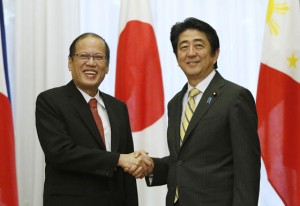 President Benigno Aquino 3rd shakes hands with Japan’s Prime Minister Shinzo Abe (right) at the start of their meeting at the prime minister’s official residence in Tokyo on Tuesday. AFP PHOTO