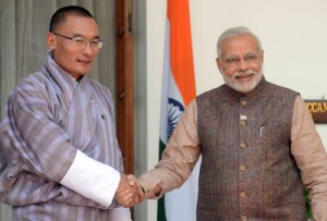 Last May 27, India’s newly sworn-in Prime Minister Narendra Modi (right) shakes hands with visiting Bhutan Prime Minister Tshering Tobgay during a meeting in New Delhi. Modi will step up a charm offensive with India’s neighbors in the hope of stopping them falling into China’s embrace, when he travels from Sunday to Bhutan on his first foreign trip since becoming prime minister. AFP PHOTO