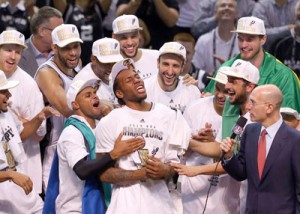 Kawhi Leonard No.2 of the San Antonio Spurs celebrates after being named the MVP following Game Five of the 2014 NBA Finals against the Miami Heat at the AT&T Center in San Antonio, Texas. AFP PHOTO
