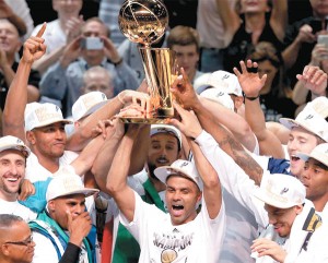 The San Antonio Spurs celebrate with the Larry O'Brien trophy after defeating the Miami Heat to win the 2014 NBA Finals at the AT&T Center on Sunday (Monday in Manila) in San Antonio, Texas. AFP PHOTO