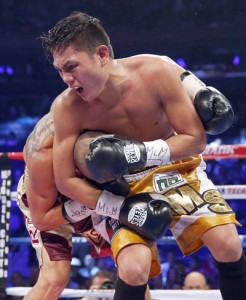 Marvin Sonsona of the Philippines puts Wilfredo Vazquez Jr. of Puerto Rico in a headlockduring the seventh round of their North American Boxing Federation featherweight title fight at the Madison Square Garden in New York City. AFP PHOTO