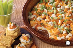 Dip into delight at your next party with this easy-to-make Buffalo Chicken Dip with a side of crackers or crudités.  