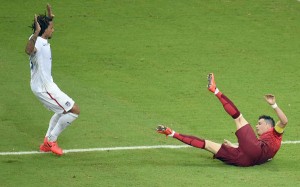 Portugal’s forward Cristiano Ronaldo (left) falls during a Group G football match between the United States and Portugal at the Amazonia Arena in Manaus on Sunday (Monday in Manila). AFP PHOTO